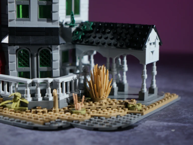 Overgrown landscaping around the Gothic manor building model