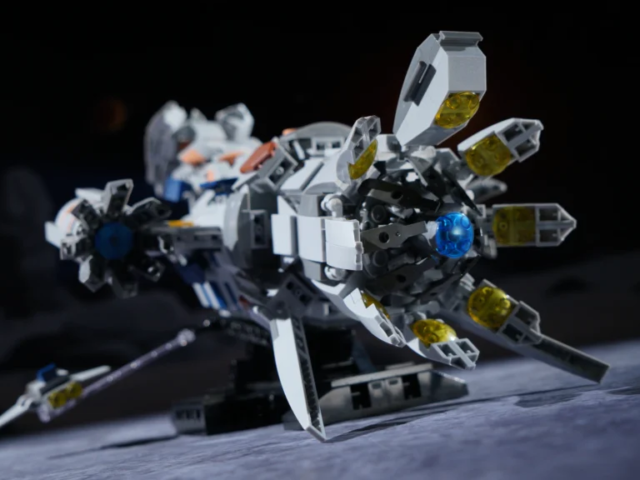 Complete deep-space cargo freighter building set on display stand